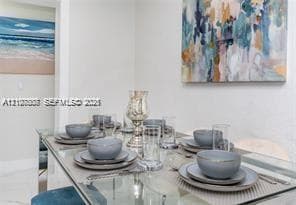 Neutral-toned interior space featuring polished stone-finish flooring and smooth-textured wall surfaces