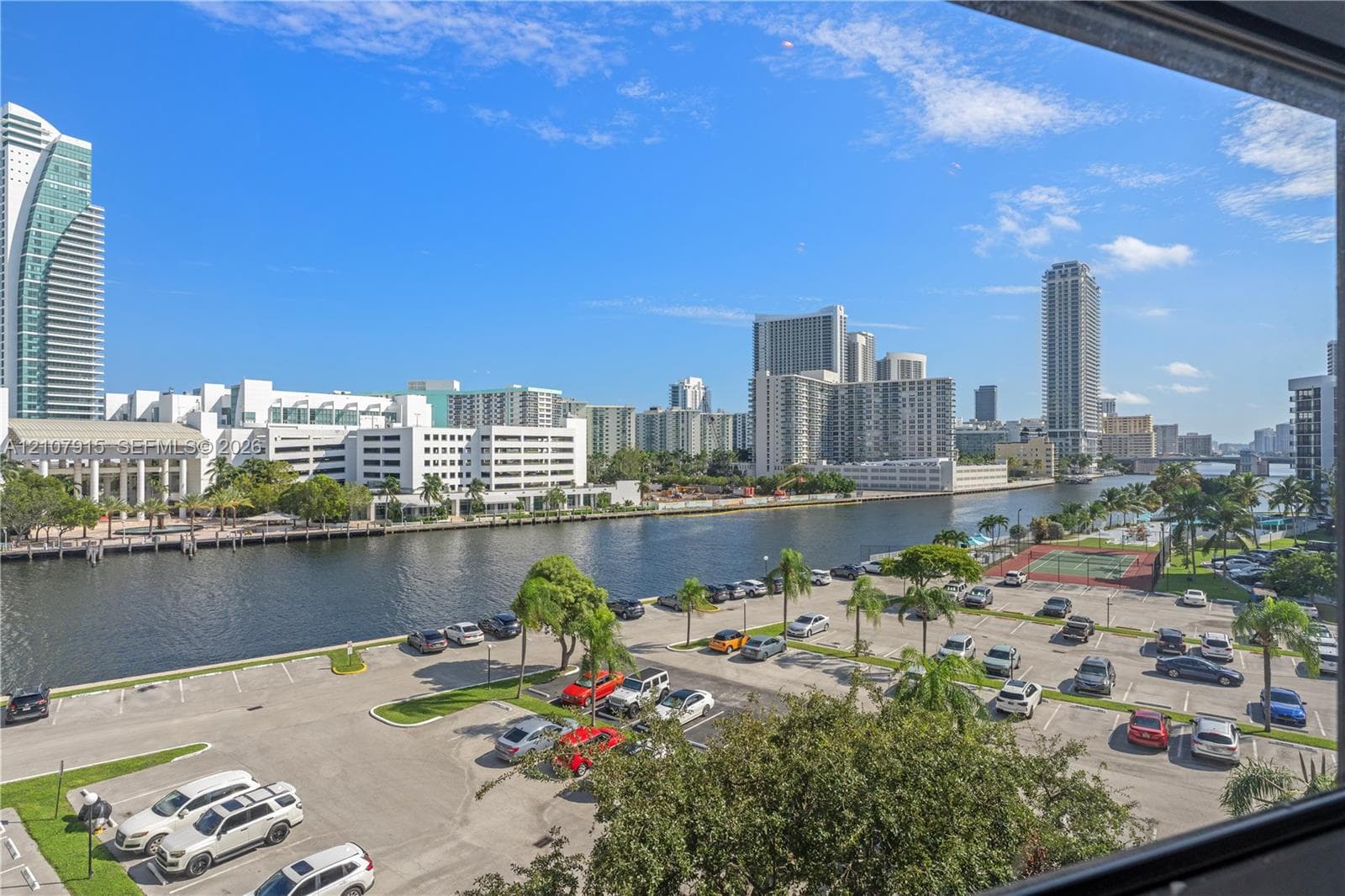 Panoramic cityscape encompassing urban high-rise buildings and an expansive waterway