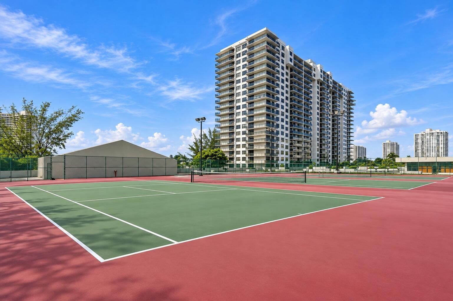 Sunny Urban Tennis Courts and Skyline