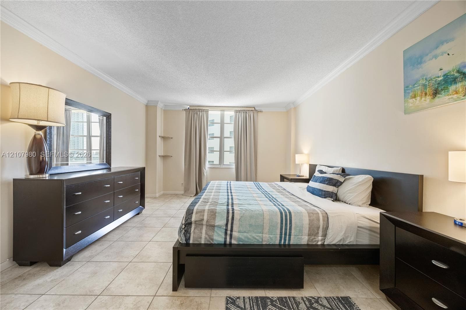 Tile flooring, crown molding, and dual built-in wall shelves