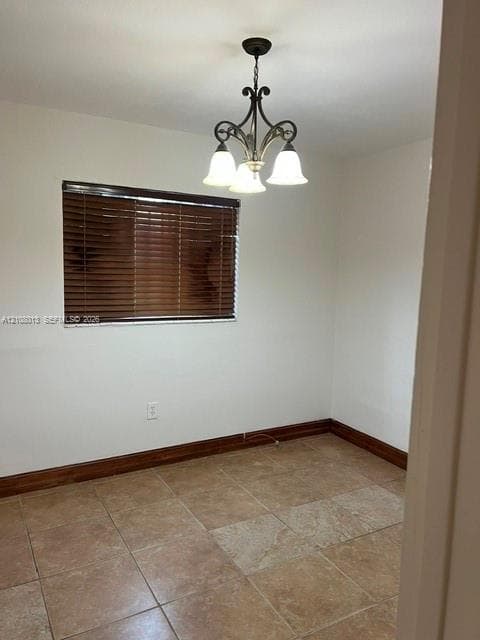 Neutral-toned tile flooring, dark wood-finish window blinds, and a traditional-style multi-light chandelier