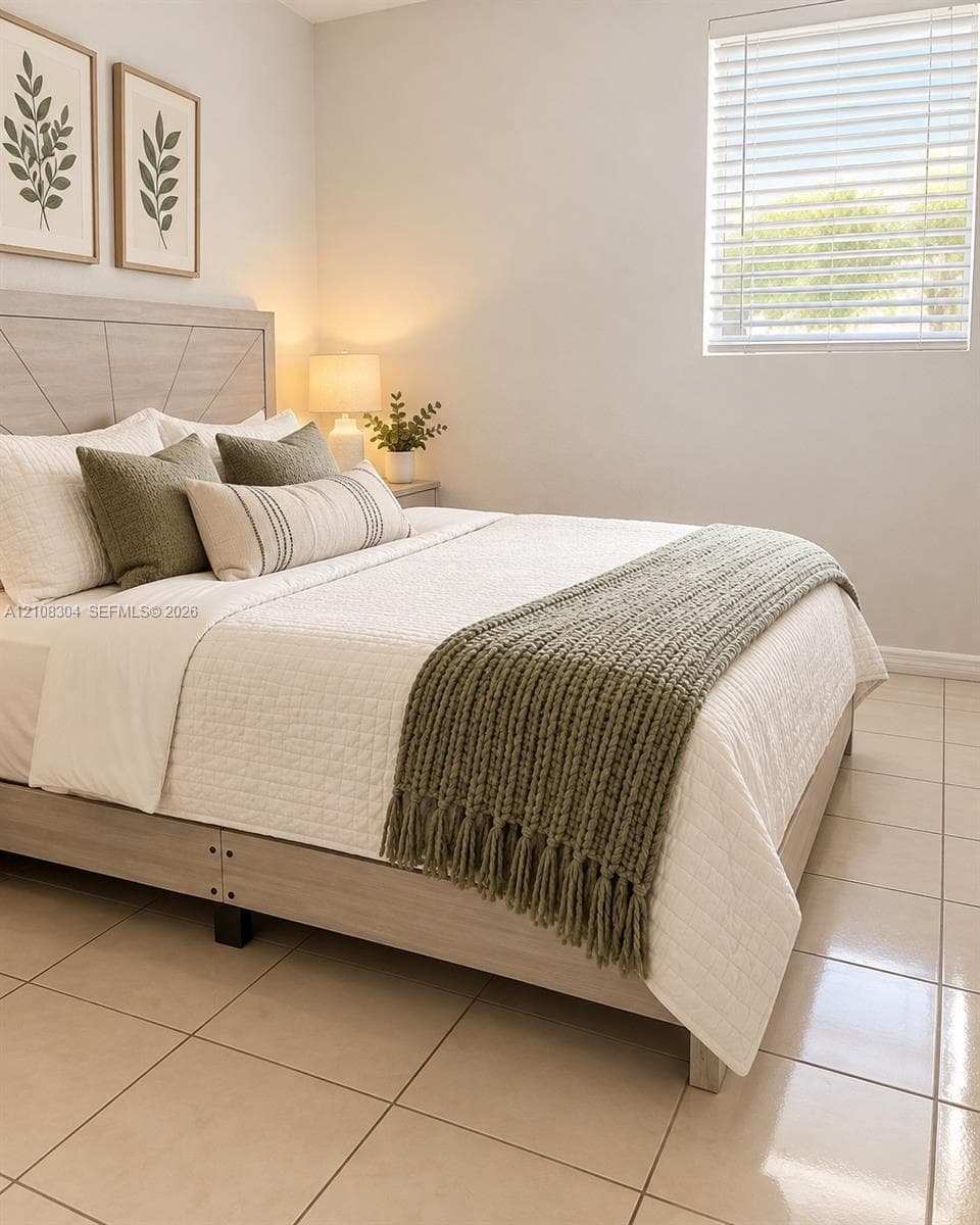 Neutral-toned tile flooring, horizontal window blinds, and crisp wall finishes