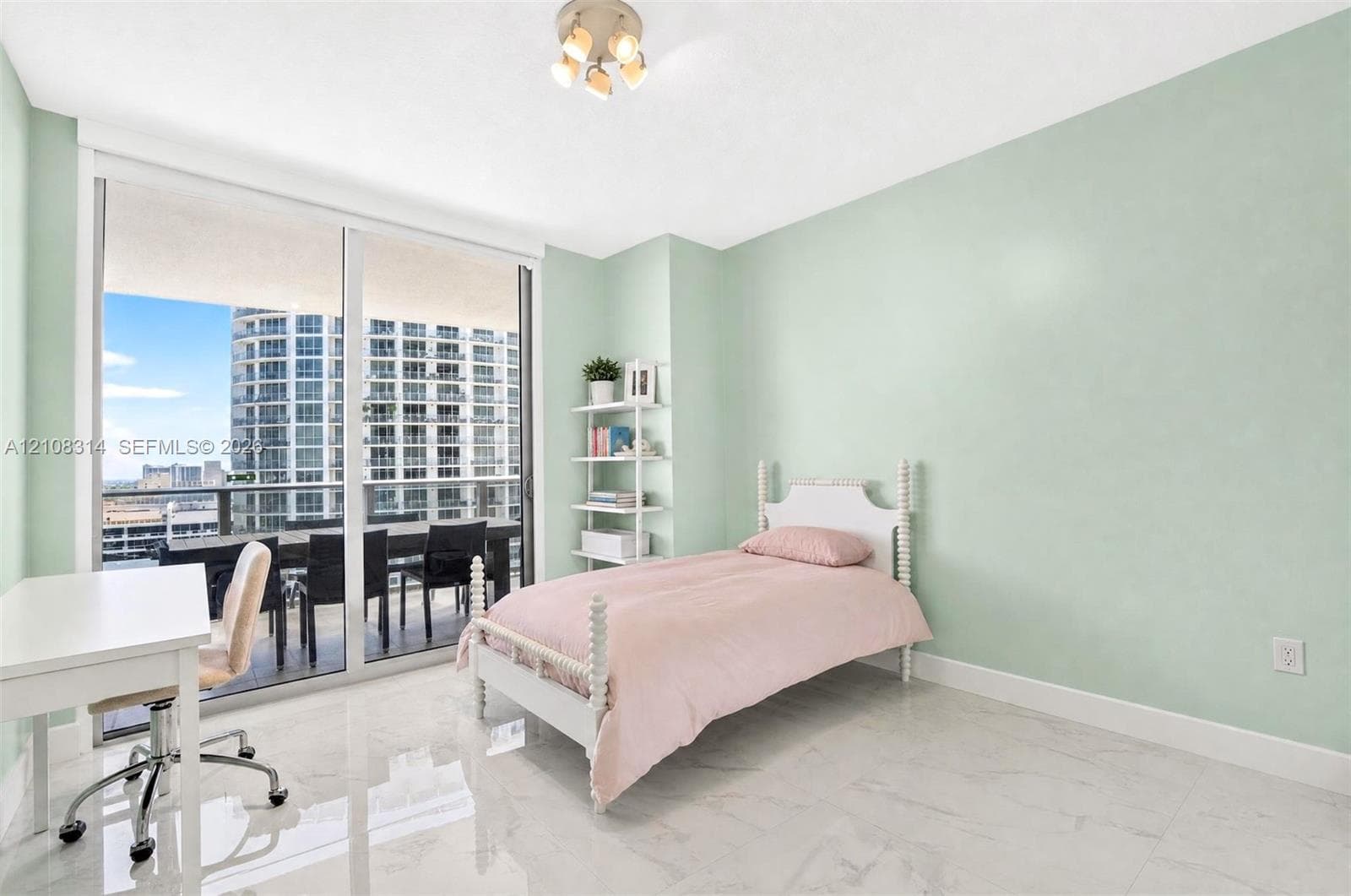 Floor-to-ceiling sliding glass doors, polished stone-finish flooring, and built-in shelving