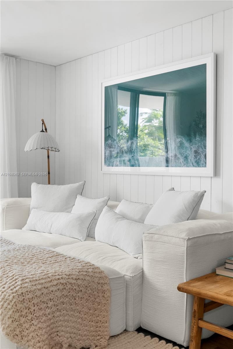 Vertical tongue-and-groove wall paneling finished in white