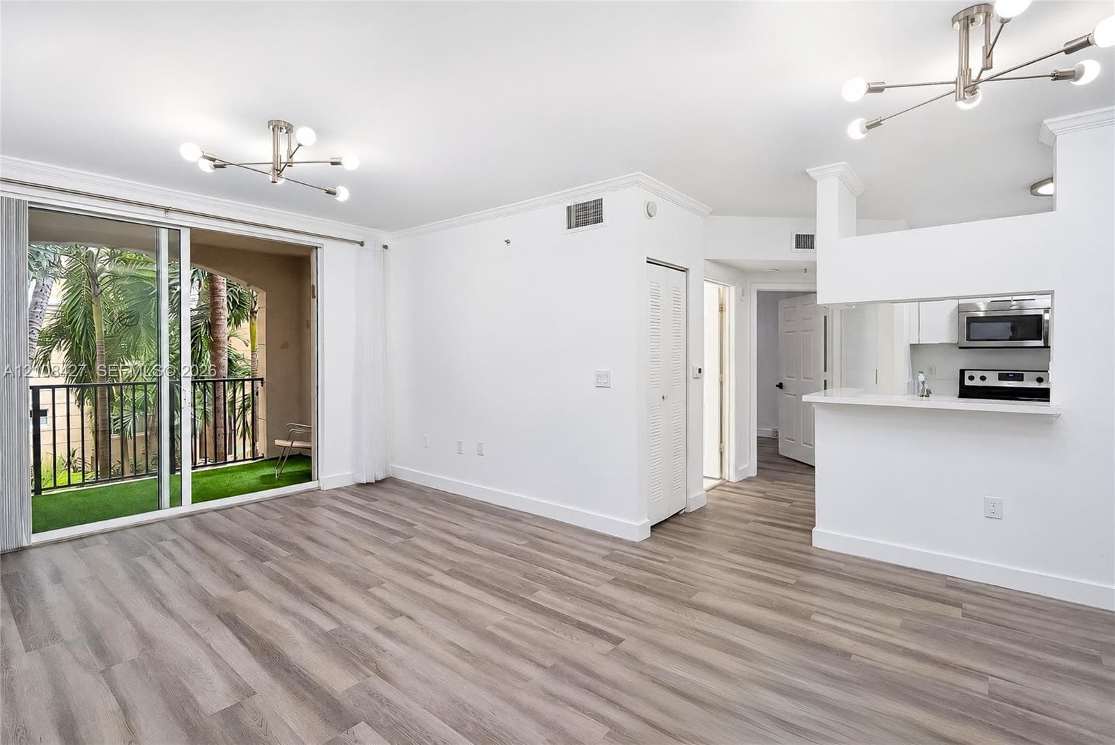 Fitness center featuring floor-to-ceiling windows, high ceilings, and rubberized flooring