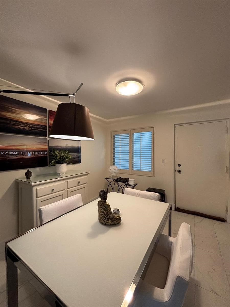 Neutral-toned interior featuring large-format tile flooring, recessed and flush-mount lighting, and window with adjustable shutters