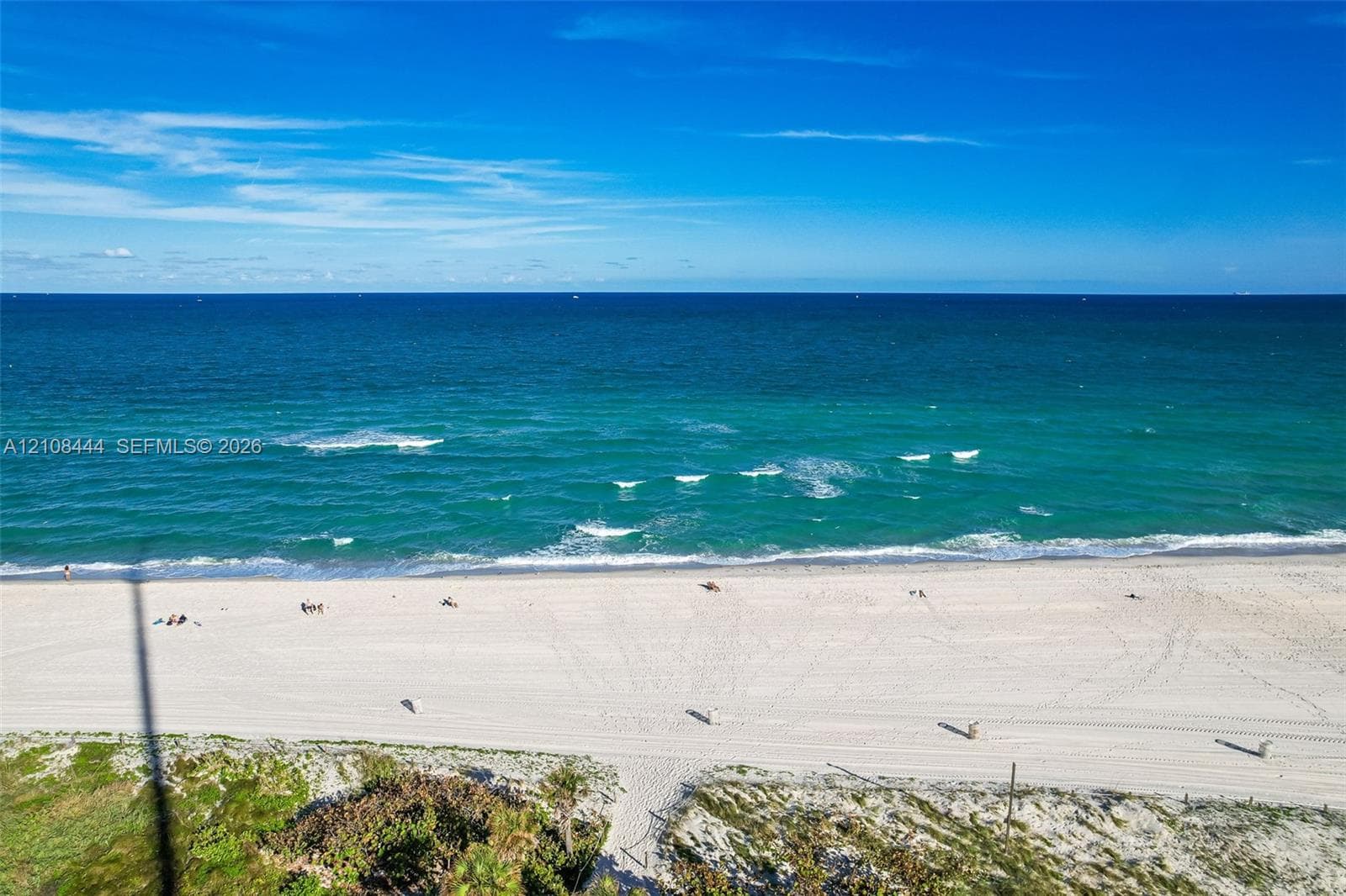 Oceanfront parcel featuring expansive sandy beach, dunes, and direct water access
