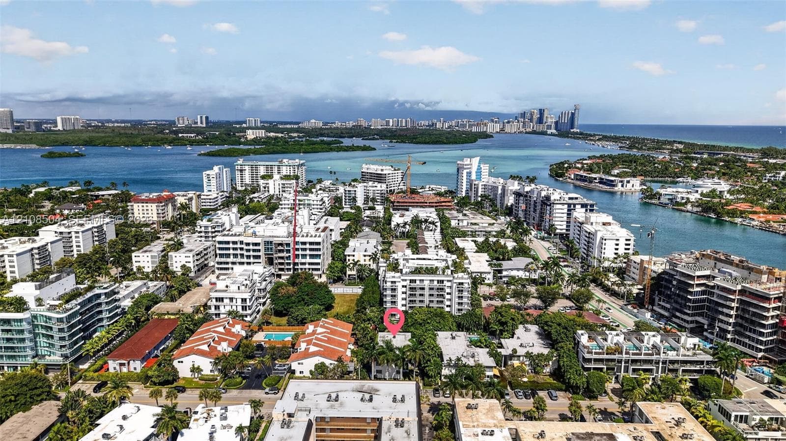Aerial perspective featuring a waterfront location with immediate access to coastal waterways and dense tropical landscaping