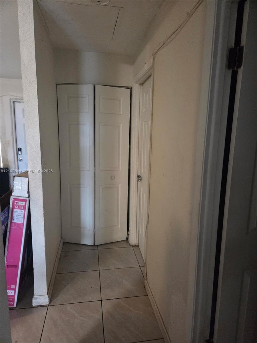 Ceramic tile flooring, bi-fold closet doors, and interior paneled doors
