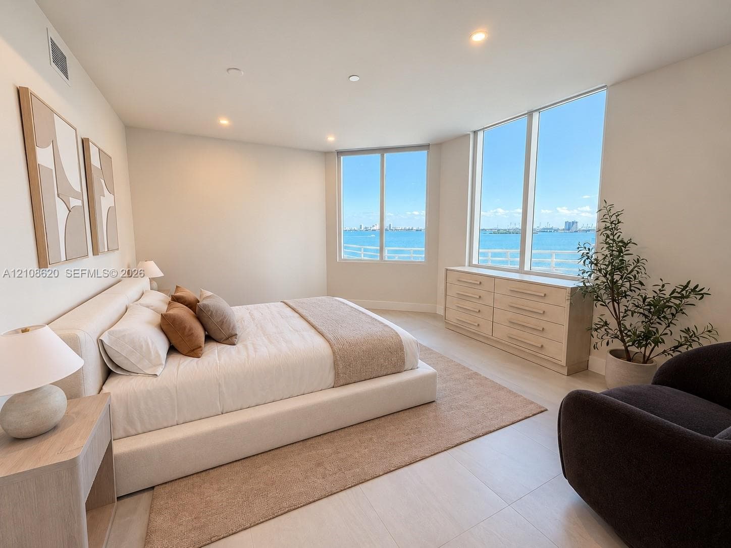 Floor-to-ceiling windows, light-toned flooring, and recessed lighting