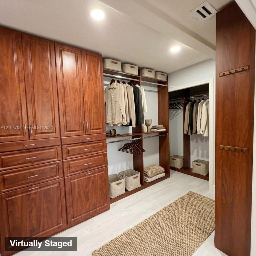 Custom wood cabinetry featuring multi-tier storage, integrated shelving, pull-out drawers, and mounted hardware