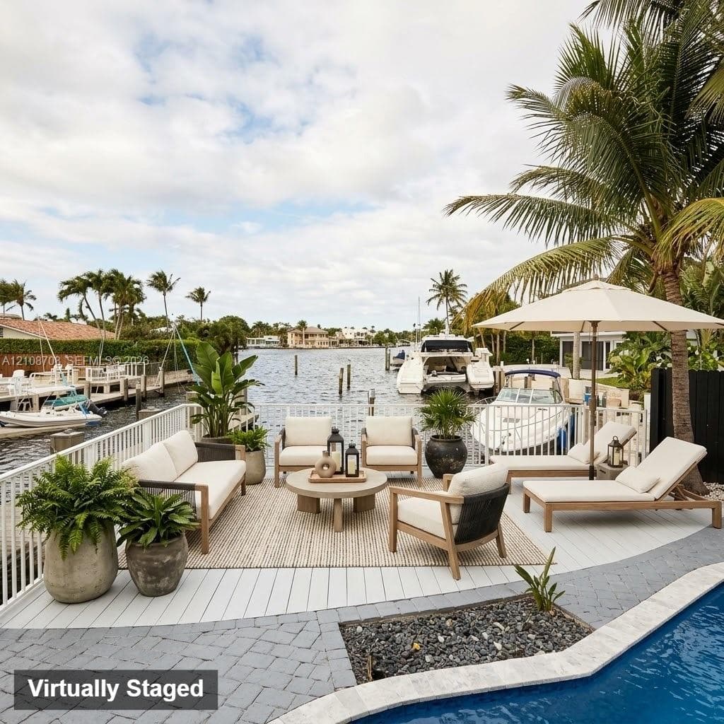 Waterfront deck with synthetic decking, metal perimeter fencing, integrated swimming pool, and stone-paver pool surround