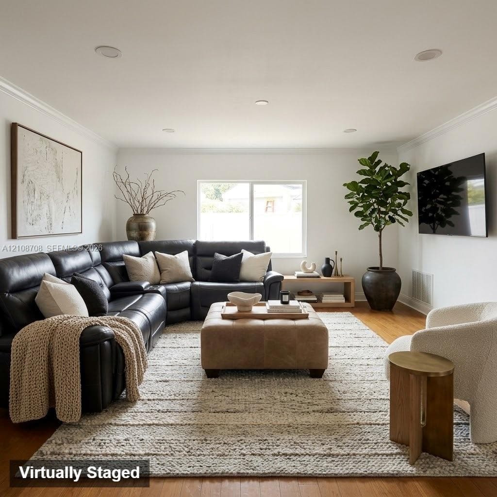 Living area featuring wood-finish flooring, recessed lighting, crown molding, and a large horizontal window