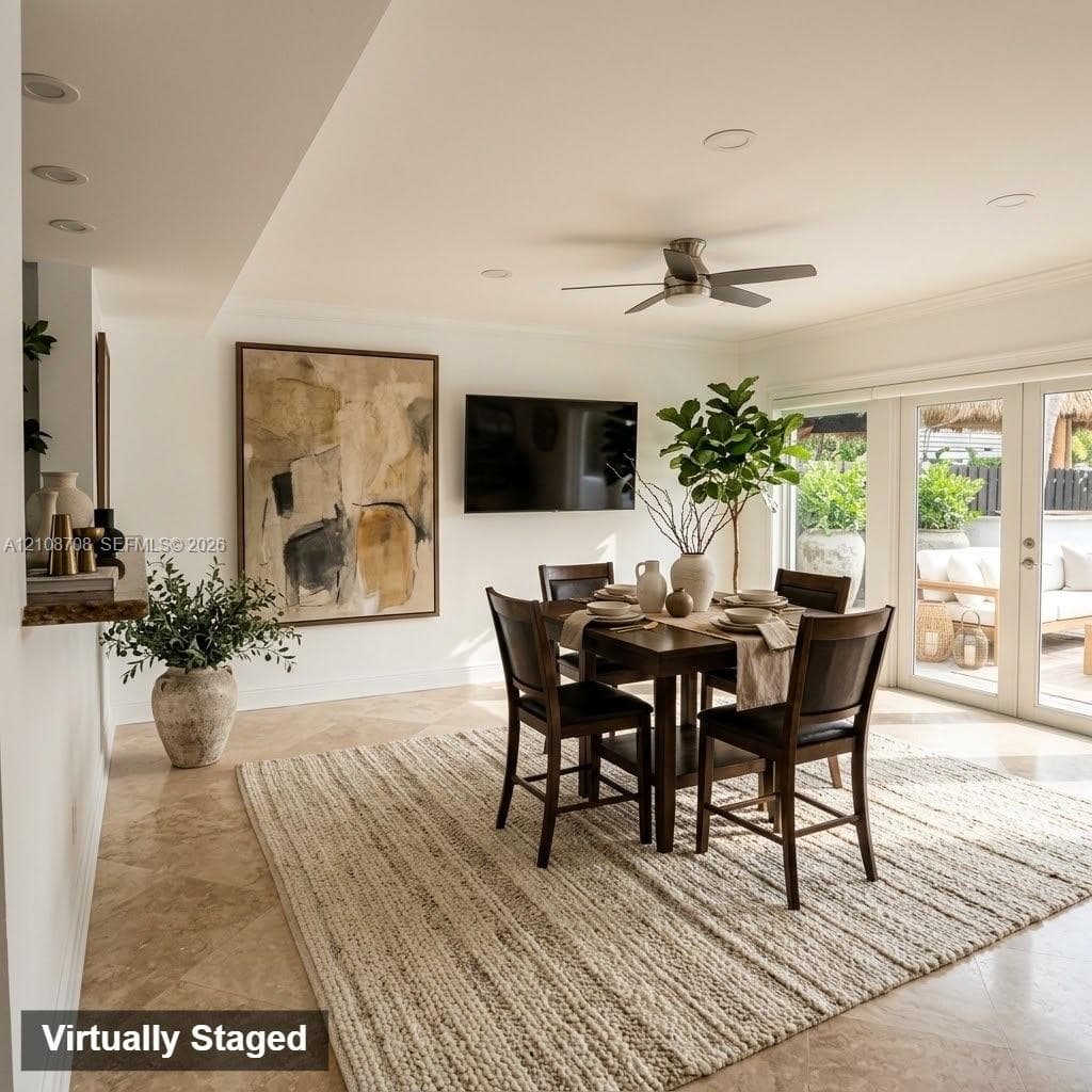 Neutral-tone stone tile flooring, recessed ceiling lighting, brushed-nickel ceiling fan, and double glass-pane doors