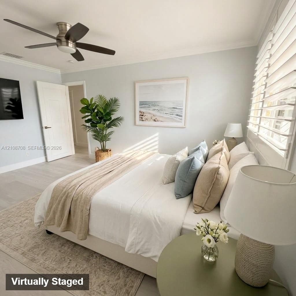 Bedroom featuring wood-finish flooring, a brushed nickel ceiling fan, multi-panel interior door, and horizontal window blinds
