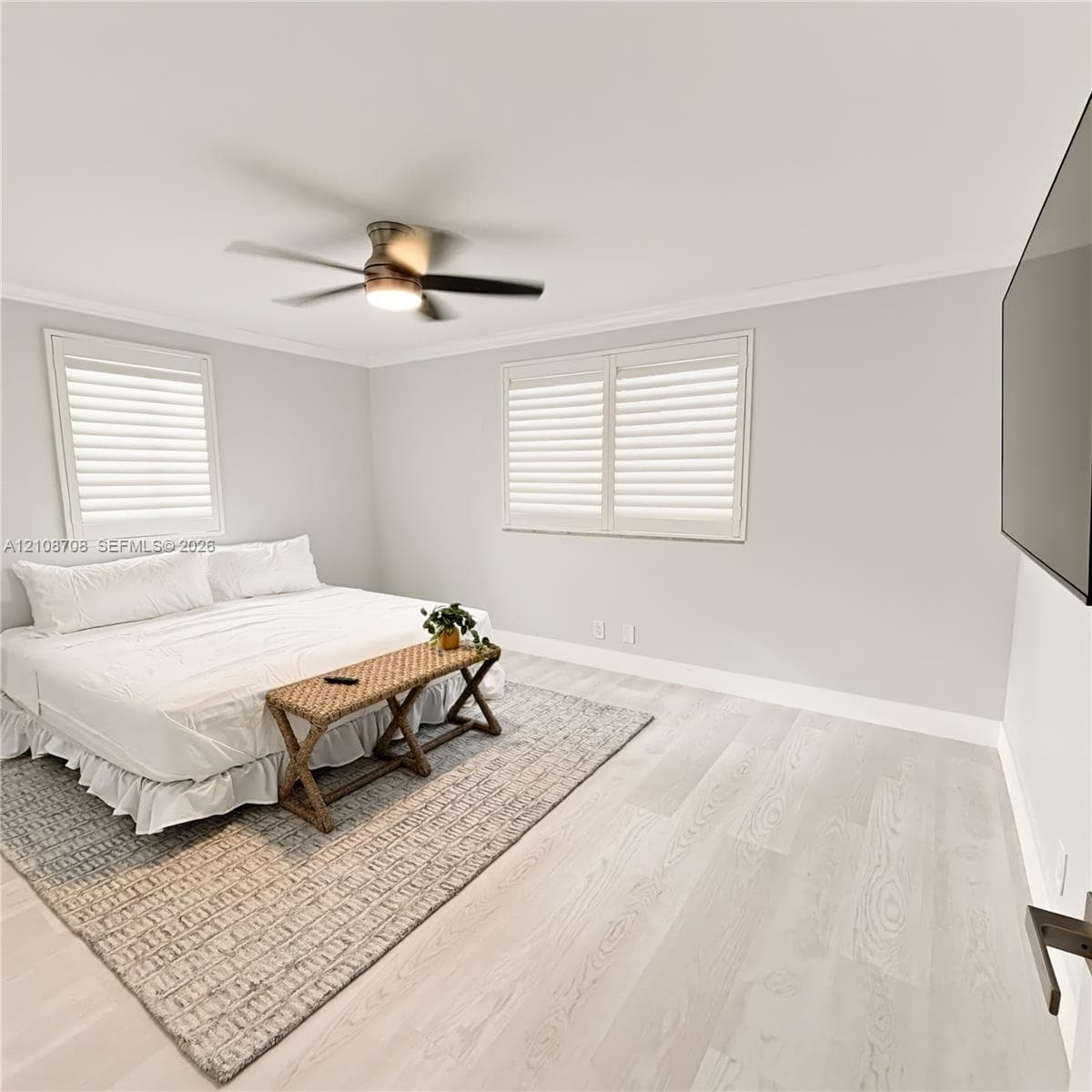 Bedroom with king bed and wood floors