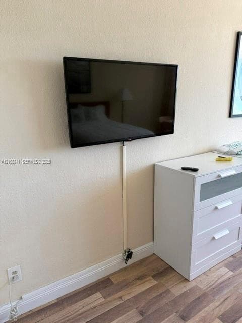 Wall-mounted display featuring wood-finish flooring