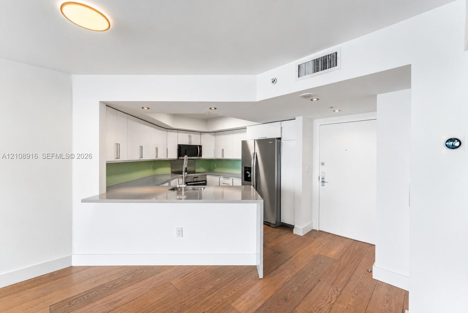 Remodeled kitchen featuring quartz counter tops and upgraded stainless steel appliances.
