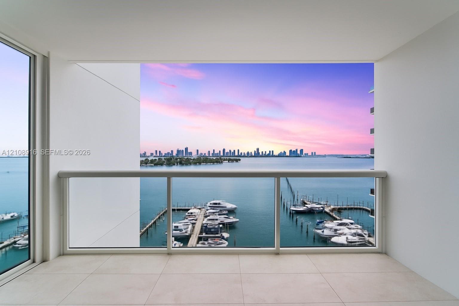 Witness the best sunsets in Miami from the balcony seamlessly connected to the living room and enhanced by newly installed natural limestone flooring.