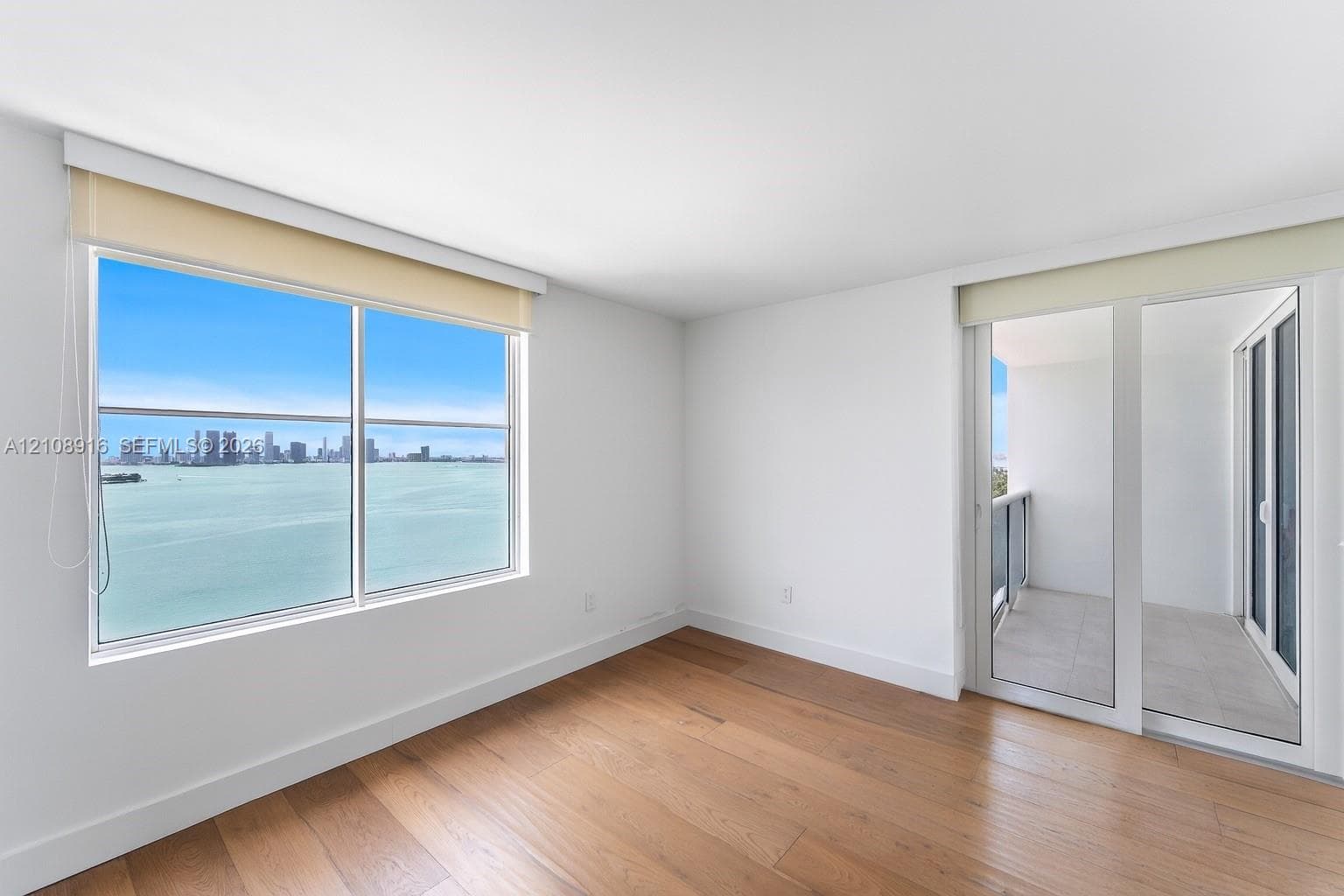 Bedroom 2 featuring access to main balcony and unprecedented bayviews.
