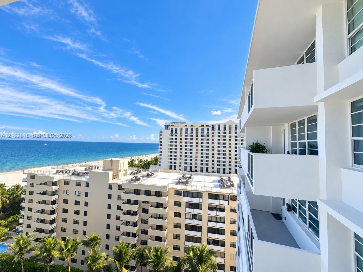 Exterior perspective featuring private balconies, multi-story structural architecture, and direct oceanfront scenery