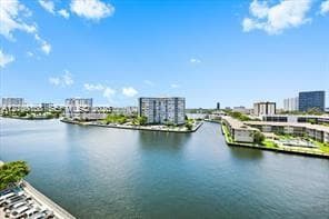 Waterfront perspective featuring urban surroundings and a canal-side landscape