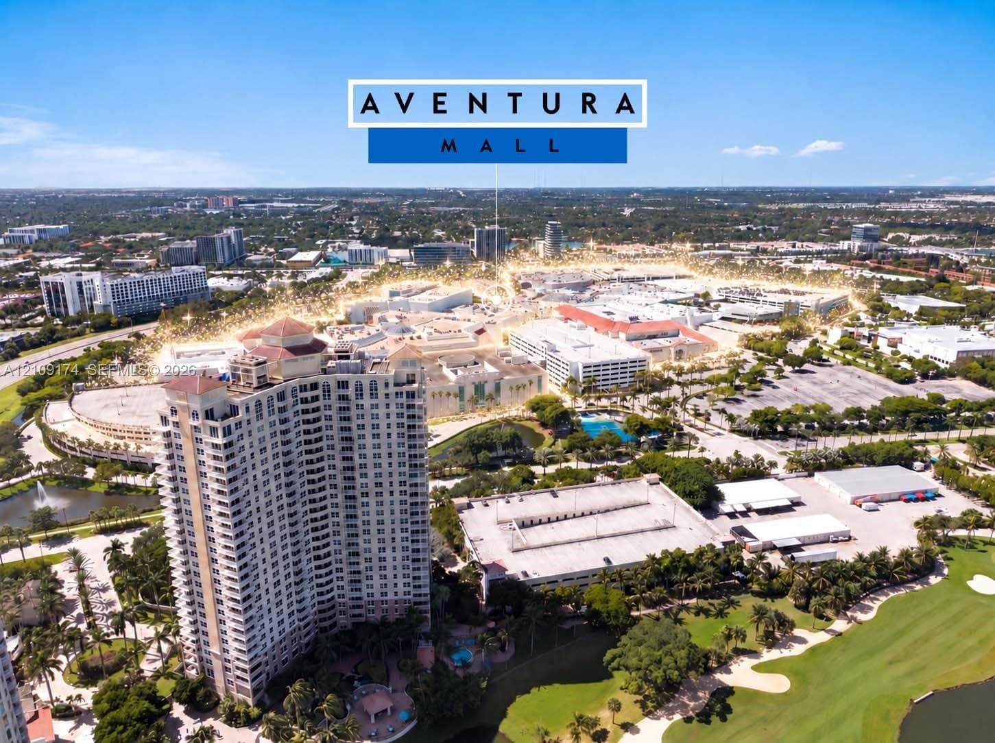 Aerial perspective of high-rise residential architecture featuring surrounding mature landscaping, water features, and expansive golf course grounds