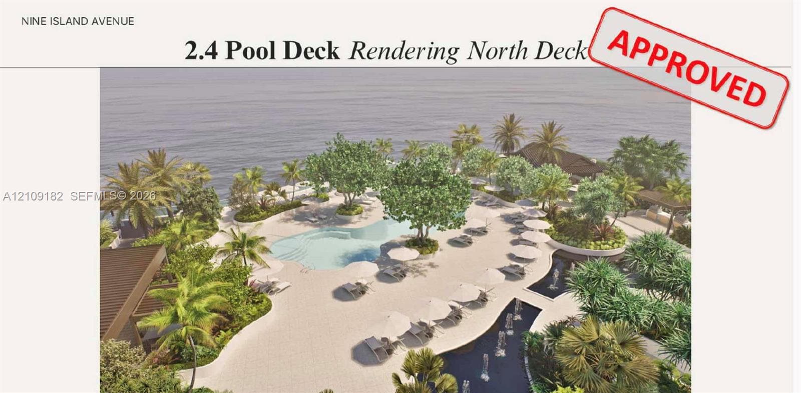 Outdoor pool area featuring a curved swimming pool, extensive paved decking, integrated landscaping, water features, and expansive waterfront positioning