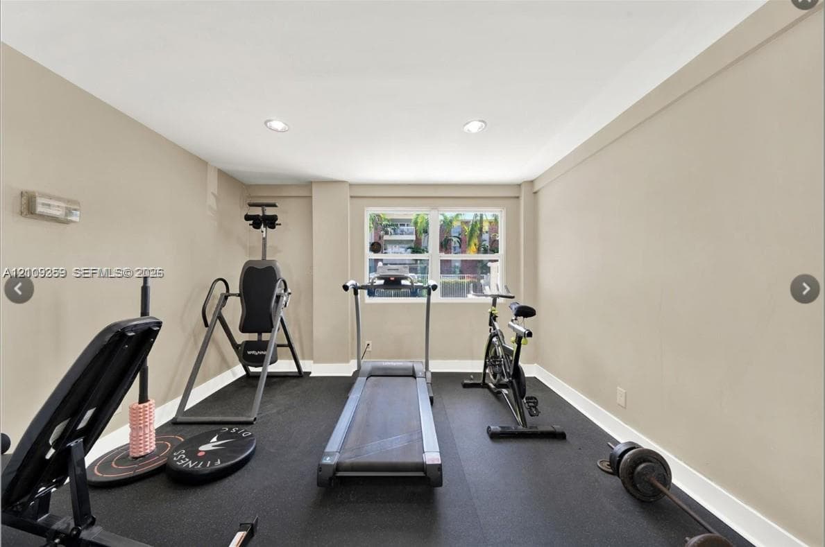 Interior room featuring neutral wall paint, recessed lighting, and impact-resistant rubberized flooring