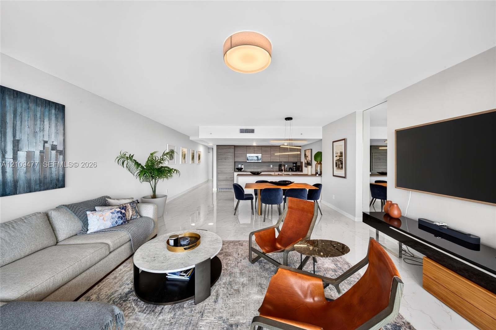 Large-format tile flooring, walk-in closet with adjustable wire shelving, and recessed ceiling lighting