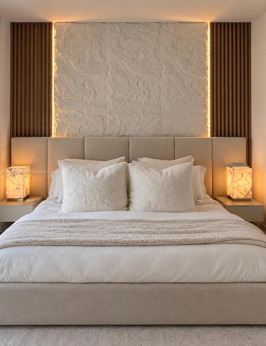 Textured stone accent wall featuring vertical wood-slat detailing, integrated perimeter lighting, and dual wall-mounted floating bedside fixtures