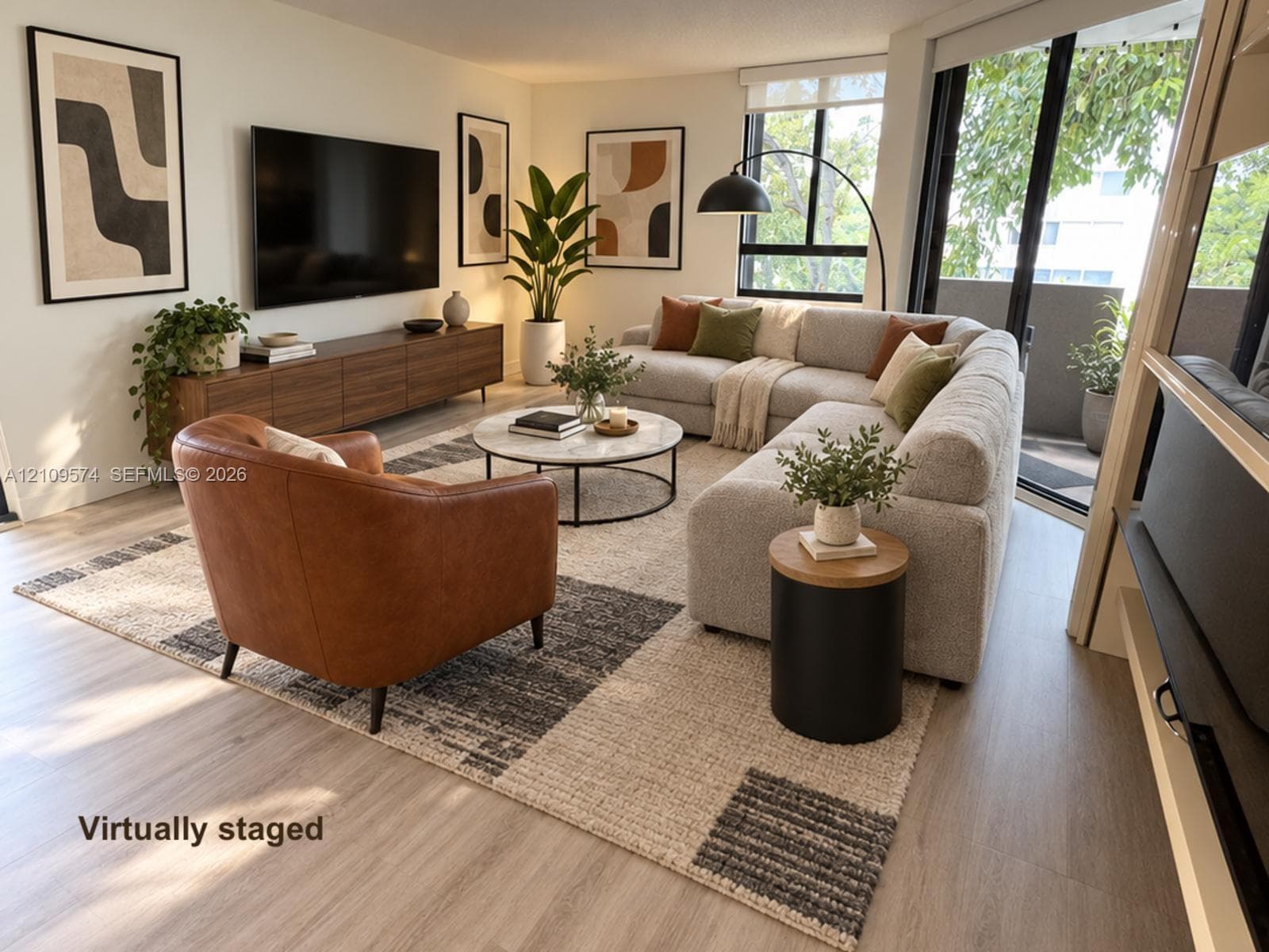 Staged. Vinyl Wood-finish flooring, floor-to-ceiling windows, and sliding glass door access to a private balcony