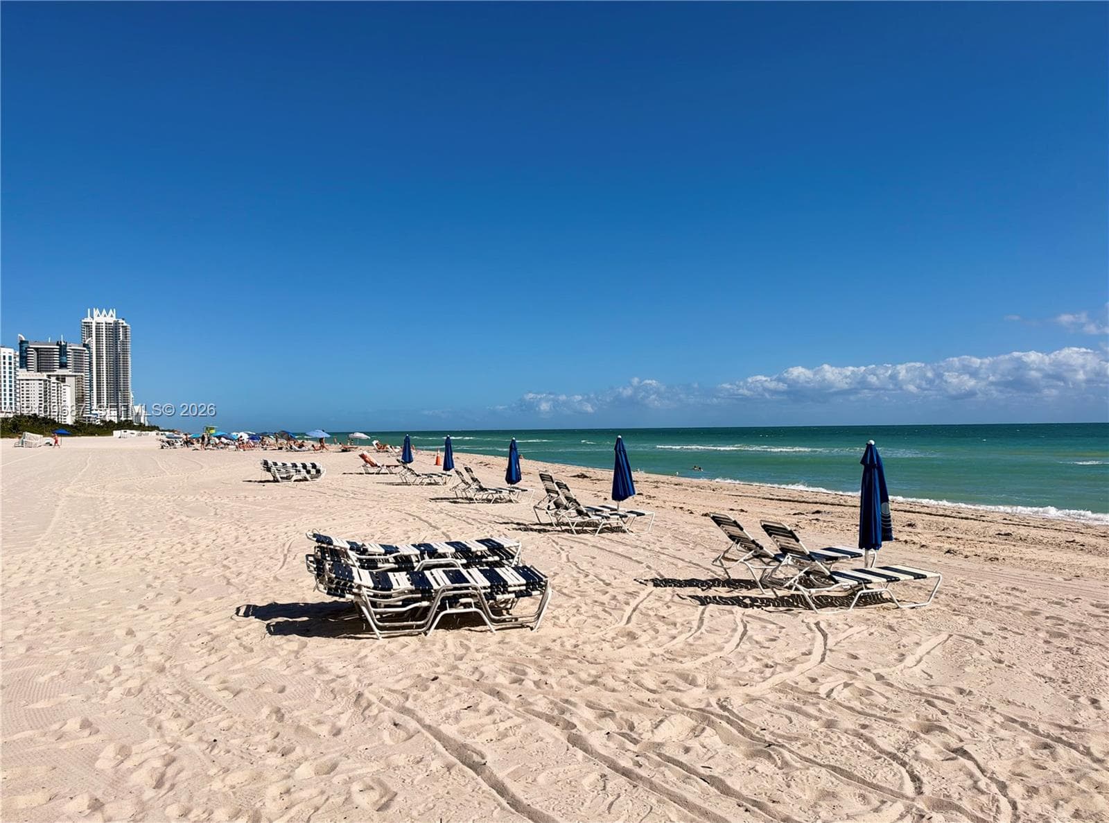 Sandy beach shoreline featuring direct coastal access