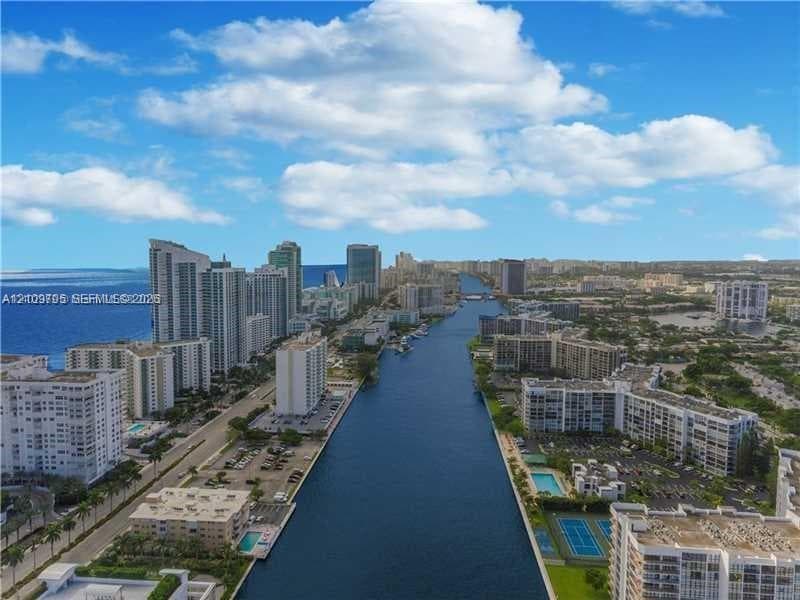 Aerial perspective of the waterway and surrounding urban high-rise landscape