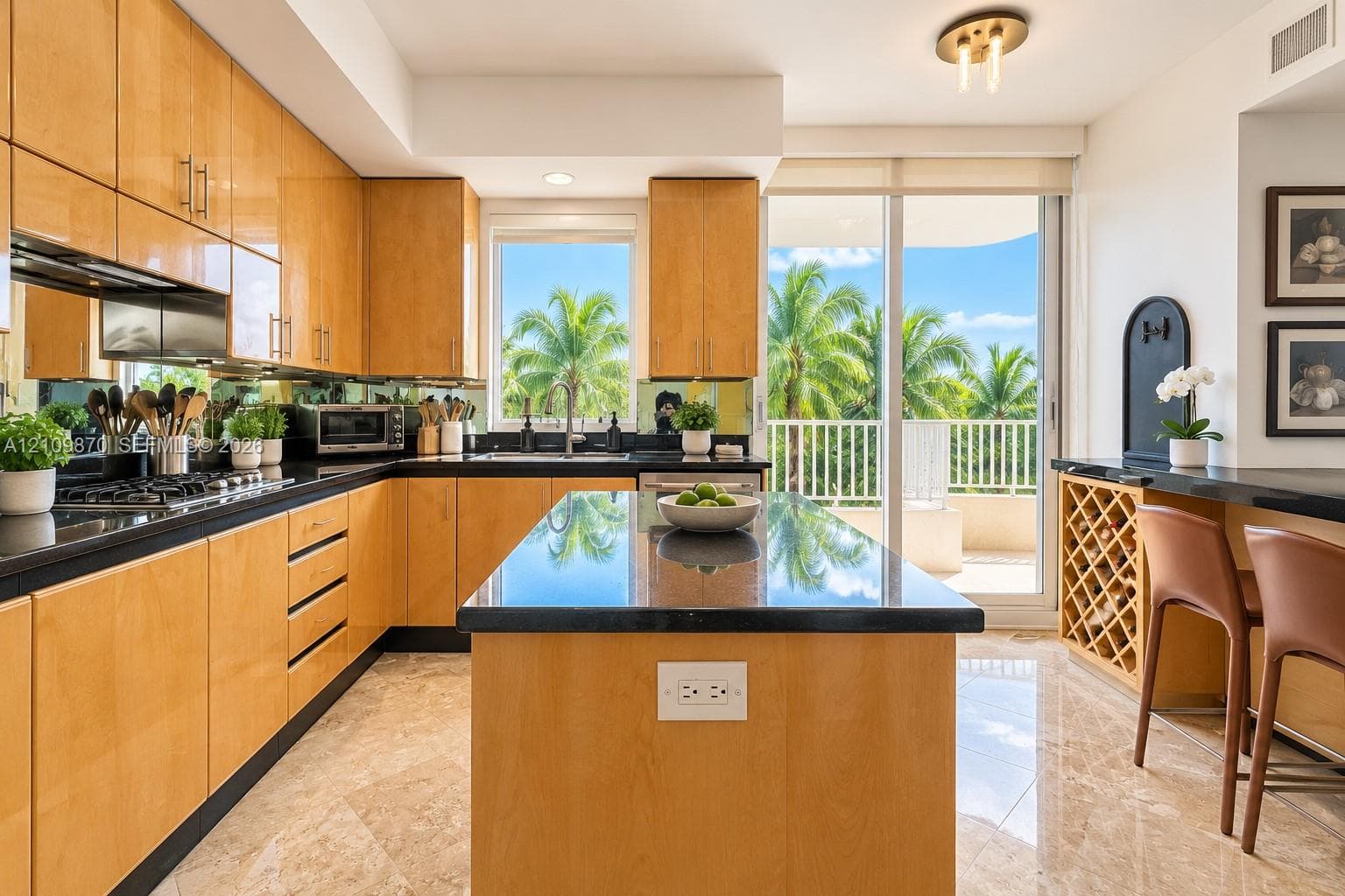 Kitchen featuring flat-panel wood cabinetry, dark stone countertops, a center island, built-in wine storage, and polished stone flooring