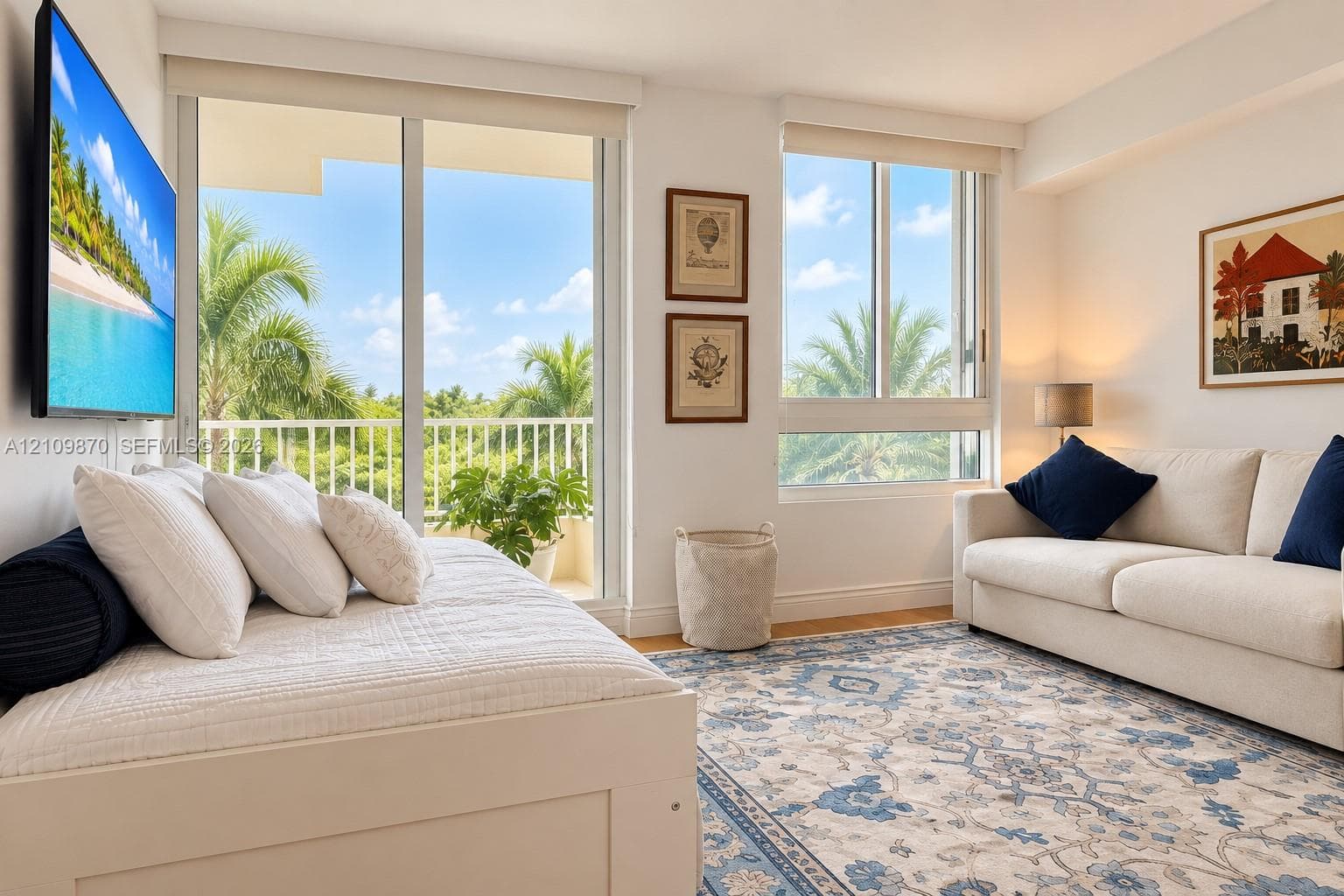 Living area featuring floor-to-ceiling glass sliding doors, horizontal windows, light-toned wall-to-wall flooring, and a private balcony with metal railing