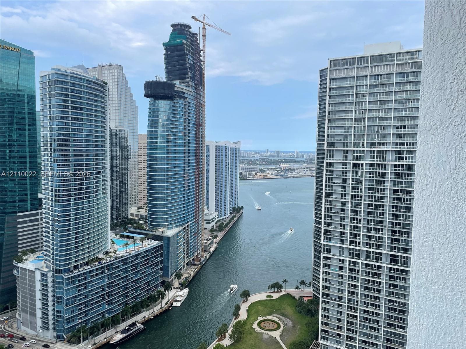 High-rise perspective featuring panoramic cityscape and water surface scenery