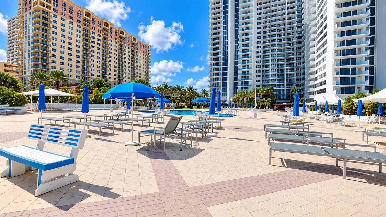 Sunny Resort Pool Deck with Palm-Lined T