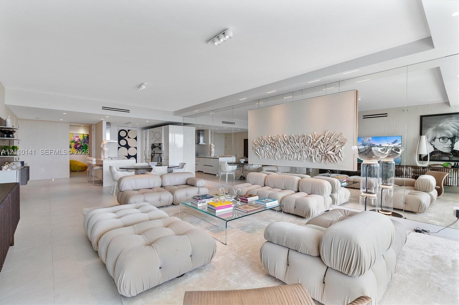 Open-concept interior wall-to-wall mirrored back wall