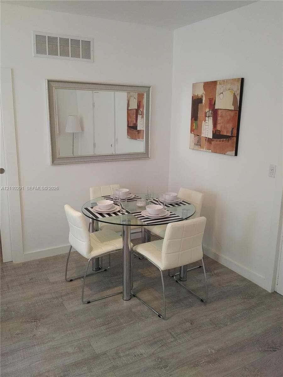 Neutral wall paint and wood-finish flooring