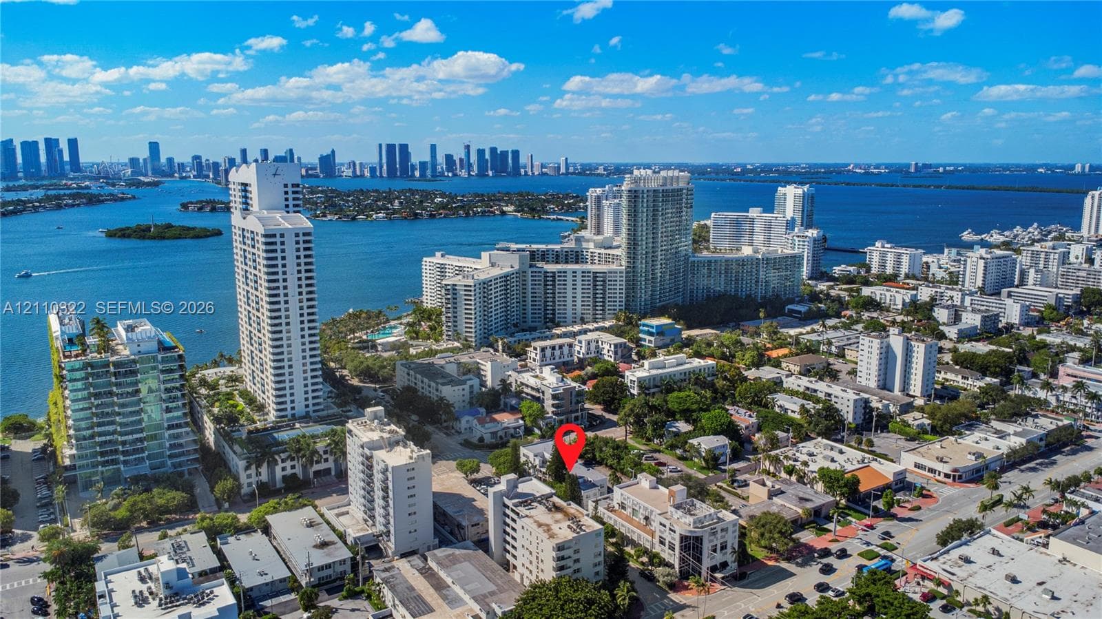 Aerial perspective featuring coastal urban proximity, expansive waterfront exposure, and dense metropolitan skyline integration