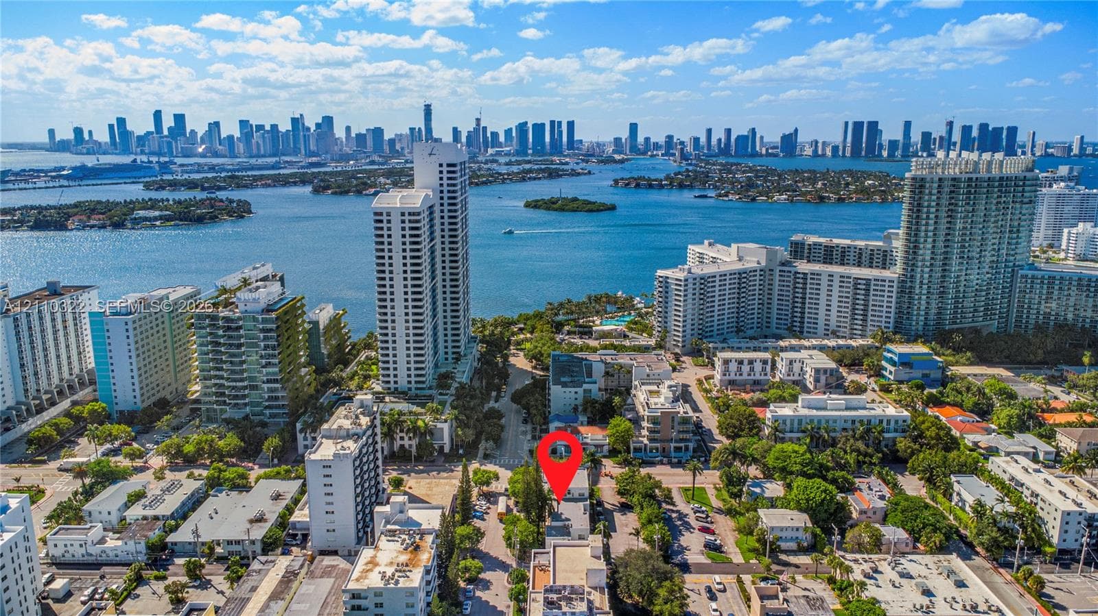 Aerial perspective featuring a metropolitan skyline and waterfront setting