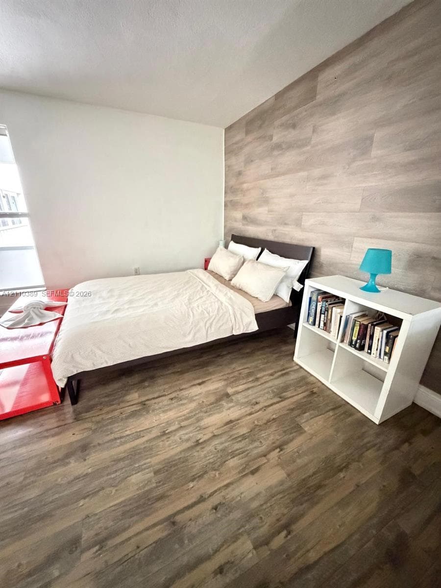 Wood-finish flooring and a decorative wood-finish plank accent wall