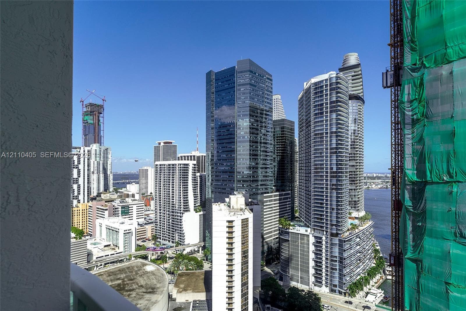 Urban cityscape featuring high-rise buildings and proximity to the waterfront