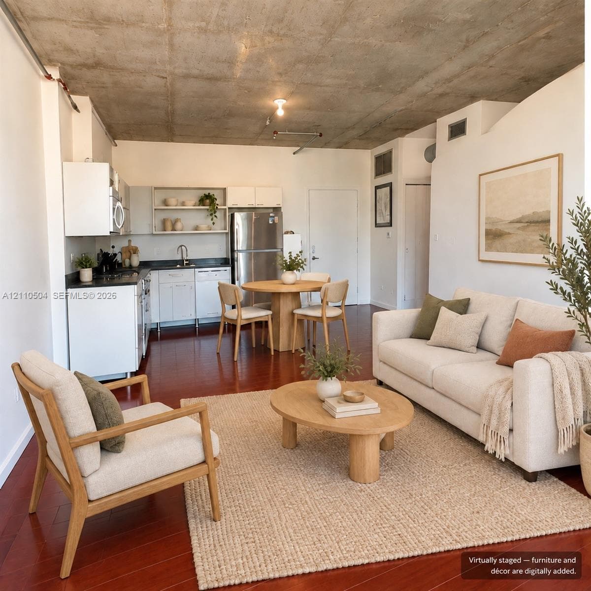 VIRTUAL STAGING -Industrial loft interior featuring exposed raw concrete ceilings, wood-finish flooring, white appliances, and white cabinetry with dark countertops