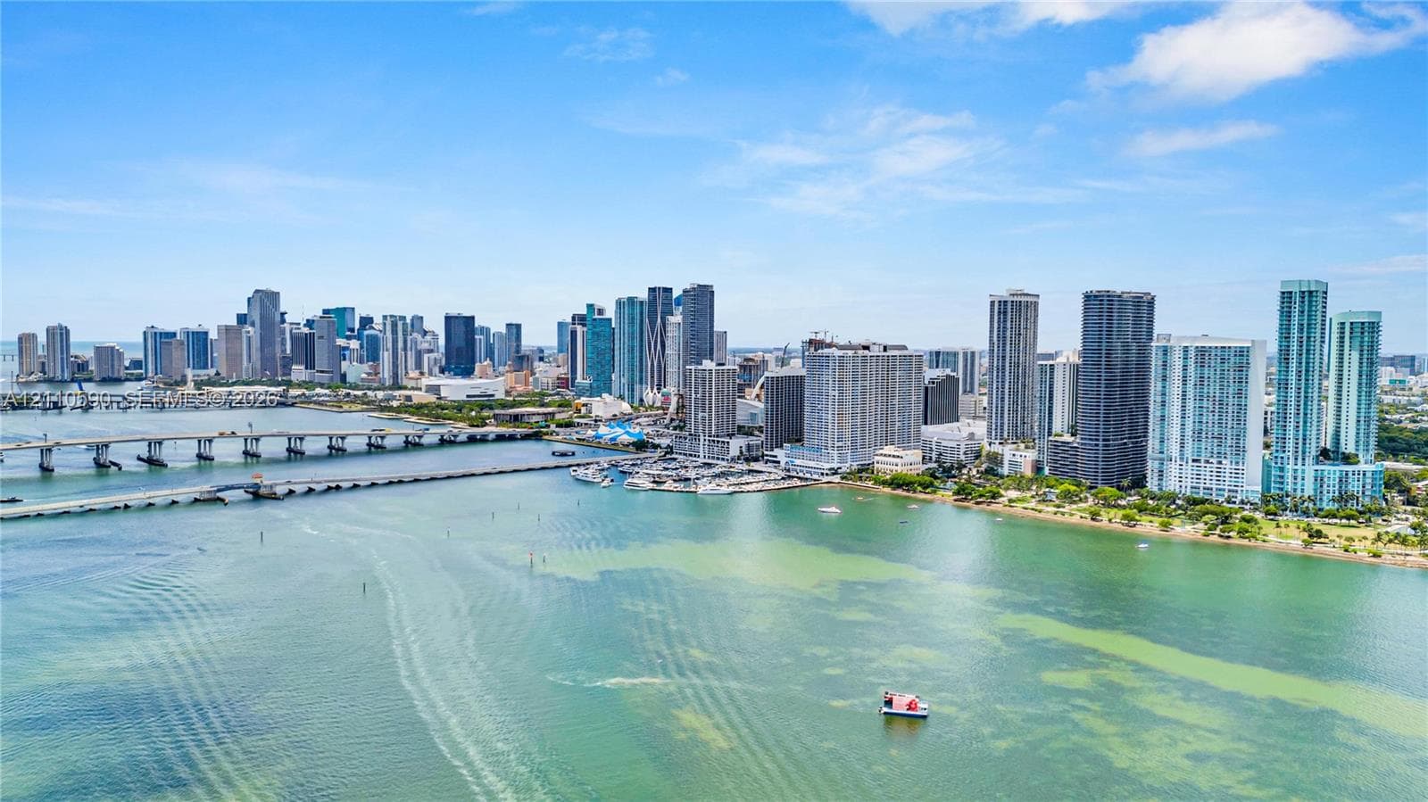 Aerial perspective showcasing expansive water frontage, direct access to urban maritime infrastructure, and panoramic metropolitan skyline