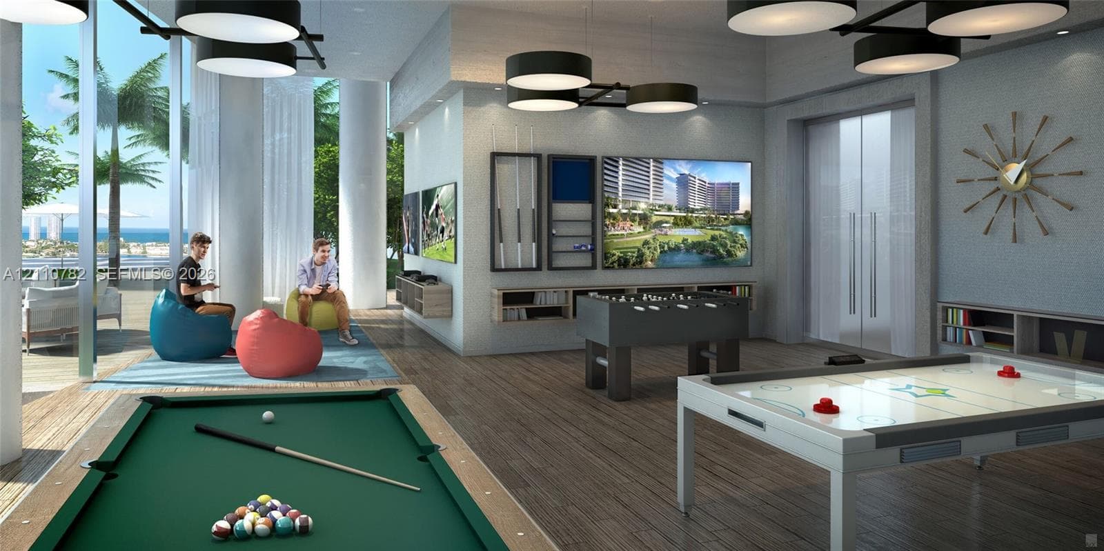 Waterfront high-rise complex situated on a peninsula, featuring multiple balconies, a swimming pool, and hardscaped recreational grounds