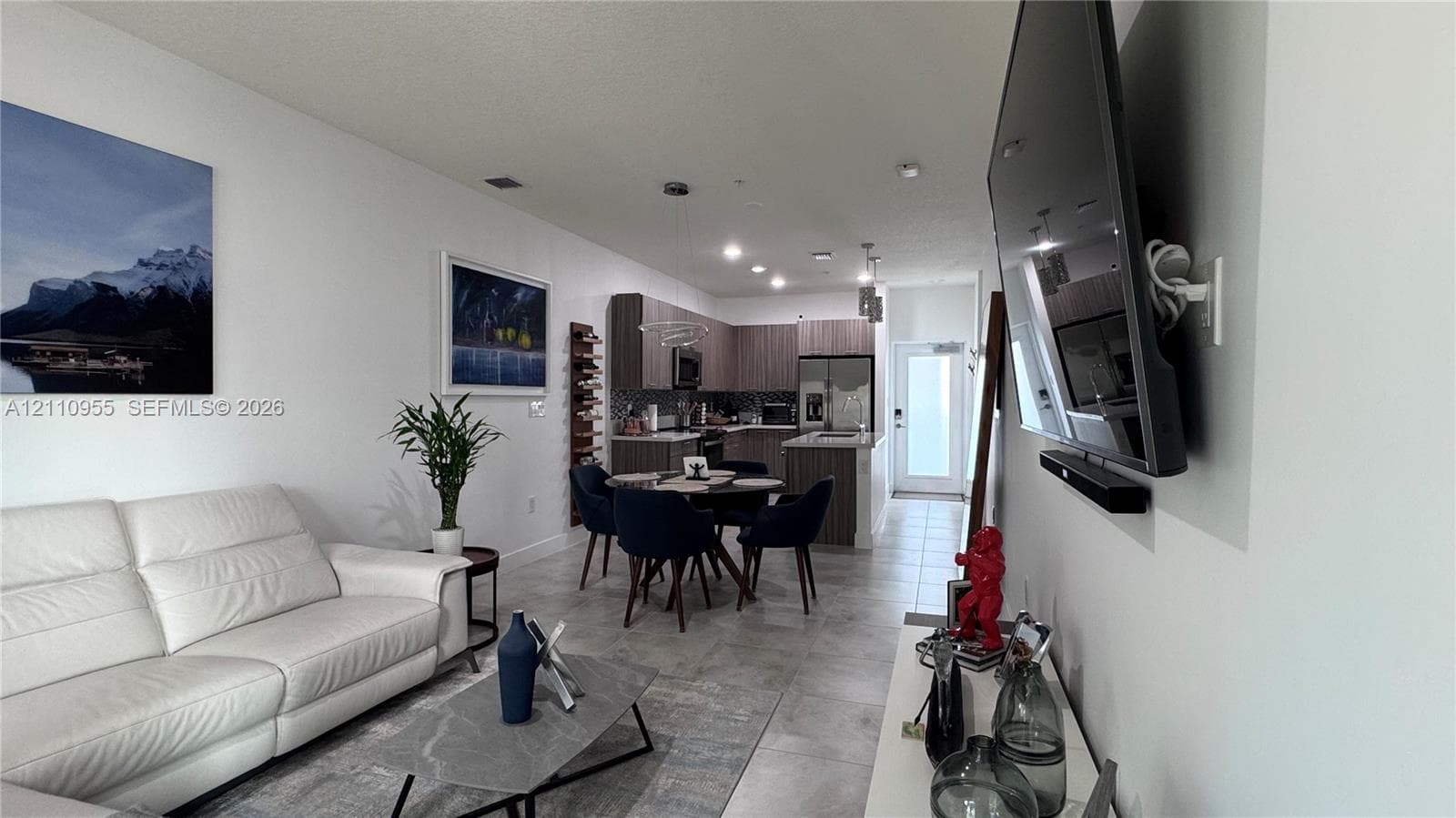 Kitchen featuring wood-finish cabinetry, recessed ceiling lighting, and tile flooring