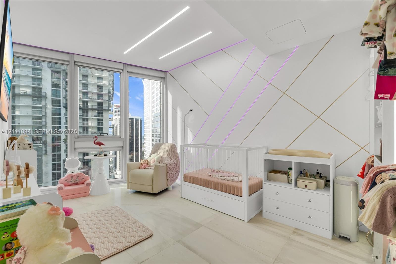 Floor-to-ceiling windows, custom geometric wall paneling with integrated lighting, and polished stone-finish flooring
