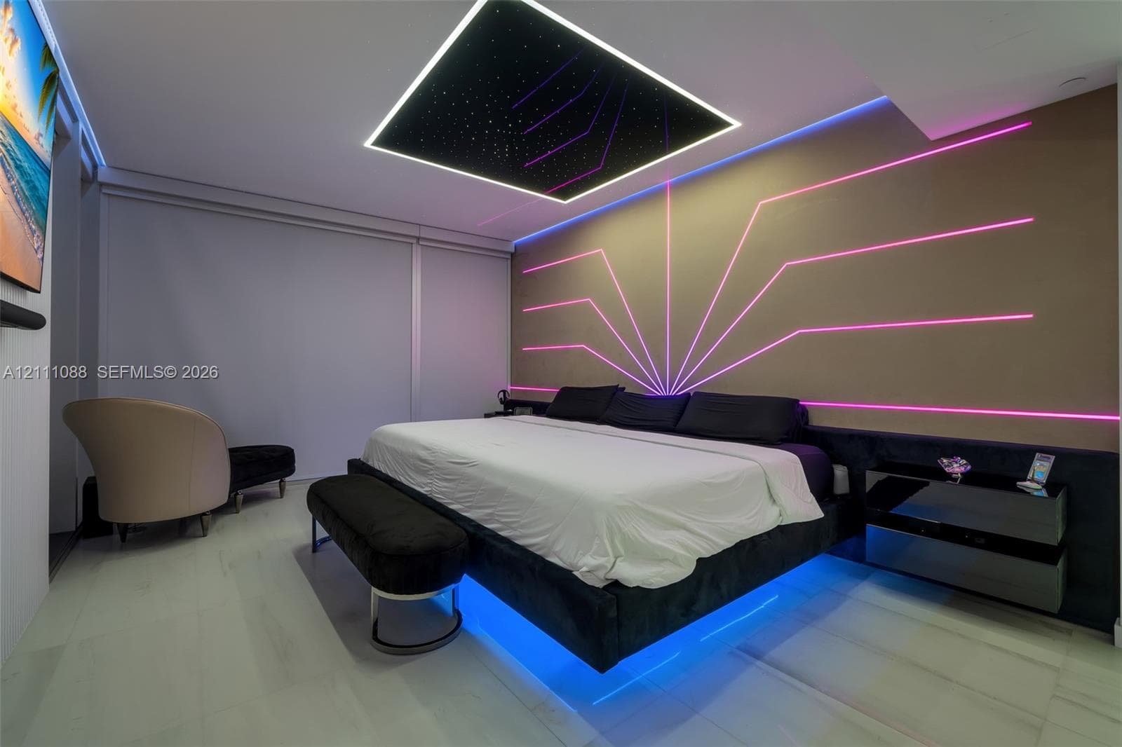 Tray ceiling featuring integrated fiber-optic lighting, wall-mounted linear accent lighting, and large-format tile flooring